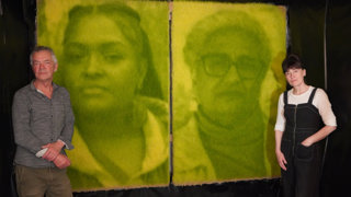 Ackroyd & Harvey standing next to two of their photographic photosynthesis portraits of Chenae Bullock and Elizabeth Solomon.