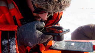 Robbie Mallet measuring ice properties.
