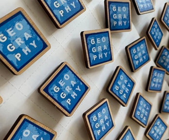 Blue squares reading the word 'geography'.