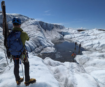 Expedition members hike across Isunnguata Sermia, a glacier of the Greenland Ice Sheet.