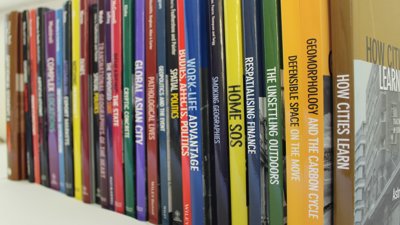 Shelf stacked with geographical journals