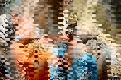 Image of Peter Rosso sitting down with his head up, smiling