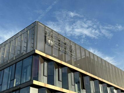 Brunel University of London buidling with blue sky background