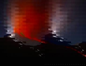 Mount Etna erupting lava