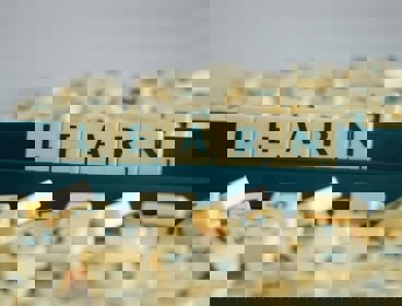 Scrabble tiles on a stand spelling out the word 'learn'