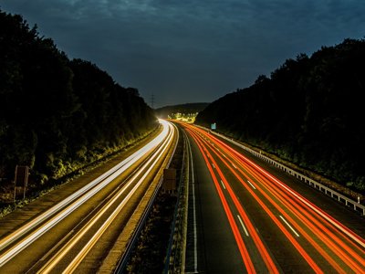 Motorway with lines of light going down the roads