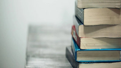 Close up of a stack of used textbooks.