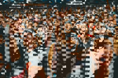 A crowd of people cheering