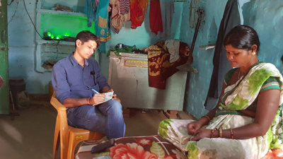 Ankit conducting his research and interviewing someone.