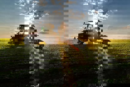 A tractor ploughing a field