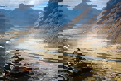 A view over a valley with a temple in the foreground