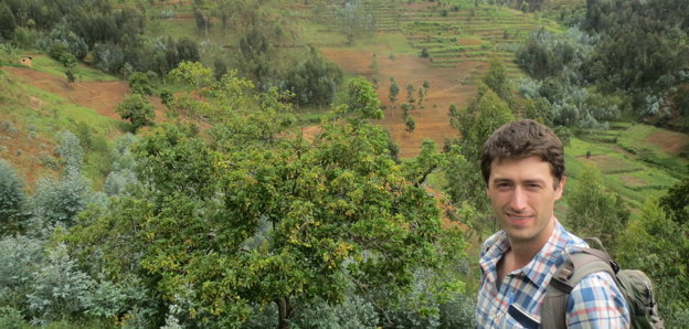 Photo showing Nathan with eucalyptus growing in Rwanda