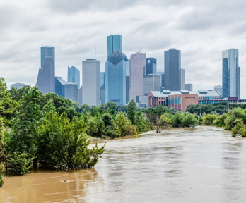 Flooded river with cityscape in background