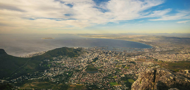 Aerial view of Cape Town, South Africa under a blue sky.