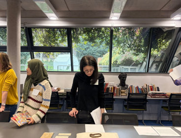 People looking at Collections during Culture& workshop