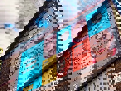 Unicef billboard that reads "Humanity needs humanity" with pictures of children