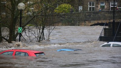Cars submerged beneath water due to flooding