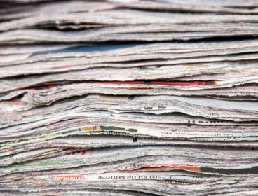 Pile of newspapers cut up.
