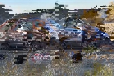 The team pushing a car