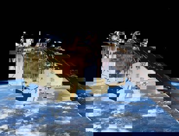 A satellite with Earth in the background, viewed from space