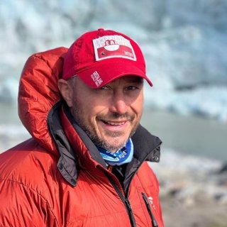 Person wearing red coat and red cap.