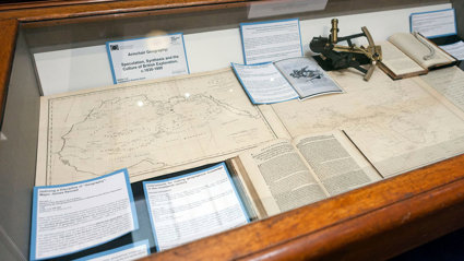 Display of historic materials including maps and books.