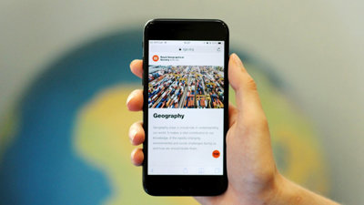 A smartphone screen displaying the Geography page of the Society's website.