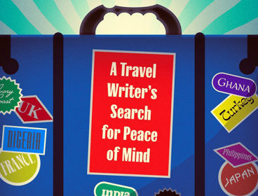 A blue suitcase with stickers all over.