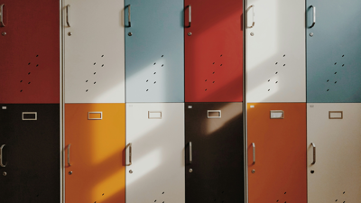 Two rows of multicoloured lockers stacked on top of each other.