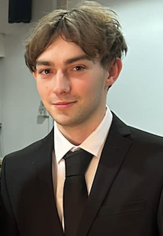 Headshot of Bradley Hart wearing a formal suit and tie.
