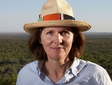 Headshot of Shane Winser standing in a field with a hat on.