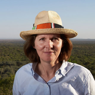 Headshot of Shane Winser standing in a field with a hat on.