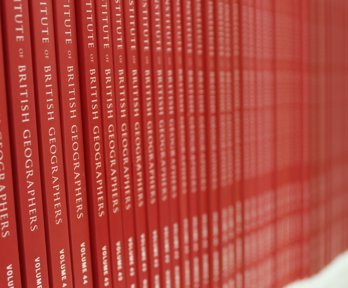 Shelf stacked with geographical journals